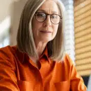 A woman working on her taxes on a computer
