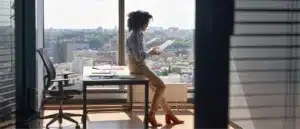 a woman reviewing paperwork for an offer in compromise