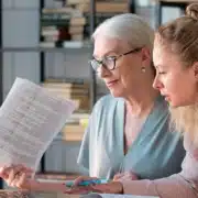 an adult child discussing financial matters with a parent