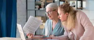 an adult child discussing financial matters with a parent