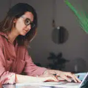 A woman working on a computer to remove a lien