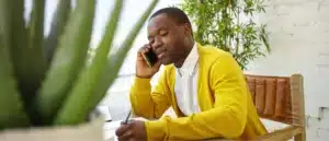A man making a phone call to remove a hold on a license