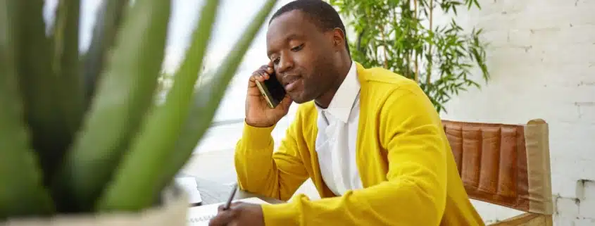 A man making a phone call to remove a hold on a license