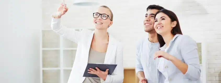 A couple looking at a property with a realtor