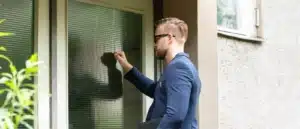 An IRS officer knocking on the door of a homeowner for a visit