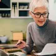 A woman reviewing her paperwork for income taxes
