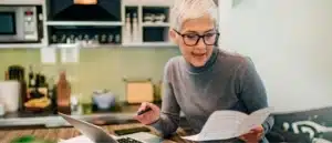 A woman reviewing her paperwork for income taxes