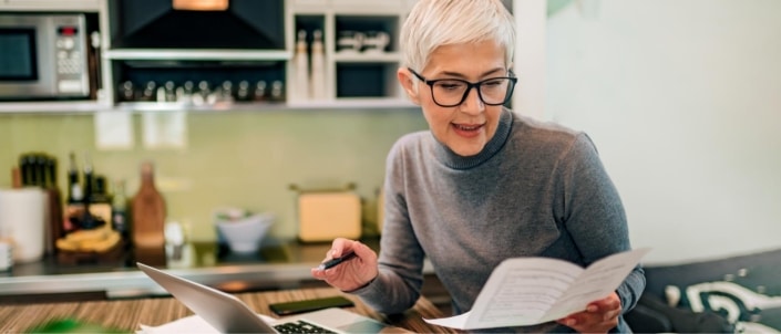A woman reviewing her paperwork for income taxes