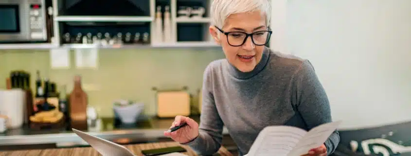A woman reviewing her paperwork for income taxes