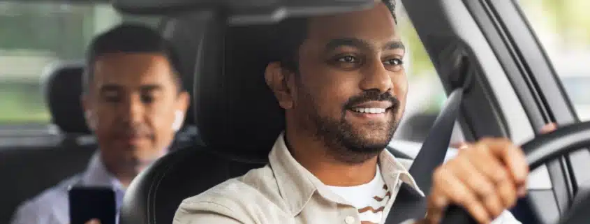 A ride-share driver driving a client