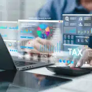 Tax planning dashboard with Taxation, and financial data for tax online payment on laptop.Businessman calculating with technology for finance, accounting, and data analysis.