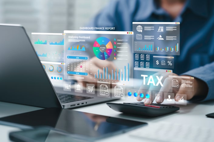 Tax planning dashboard with Taxation, and financial data for tax online payment on laptop.Businessman calculating with technology for finance, accounting, and data analysis.